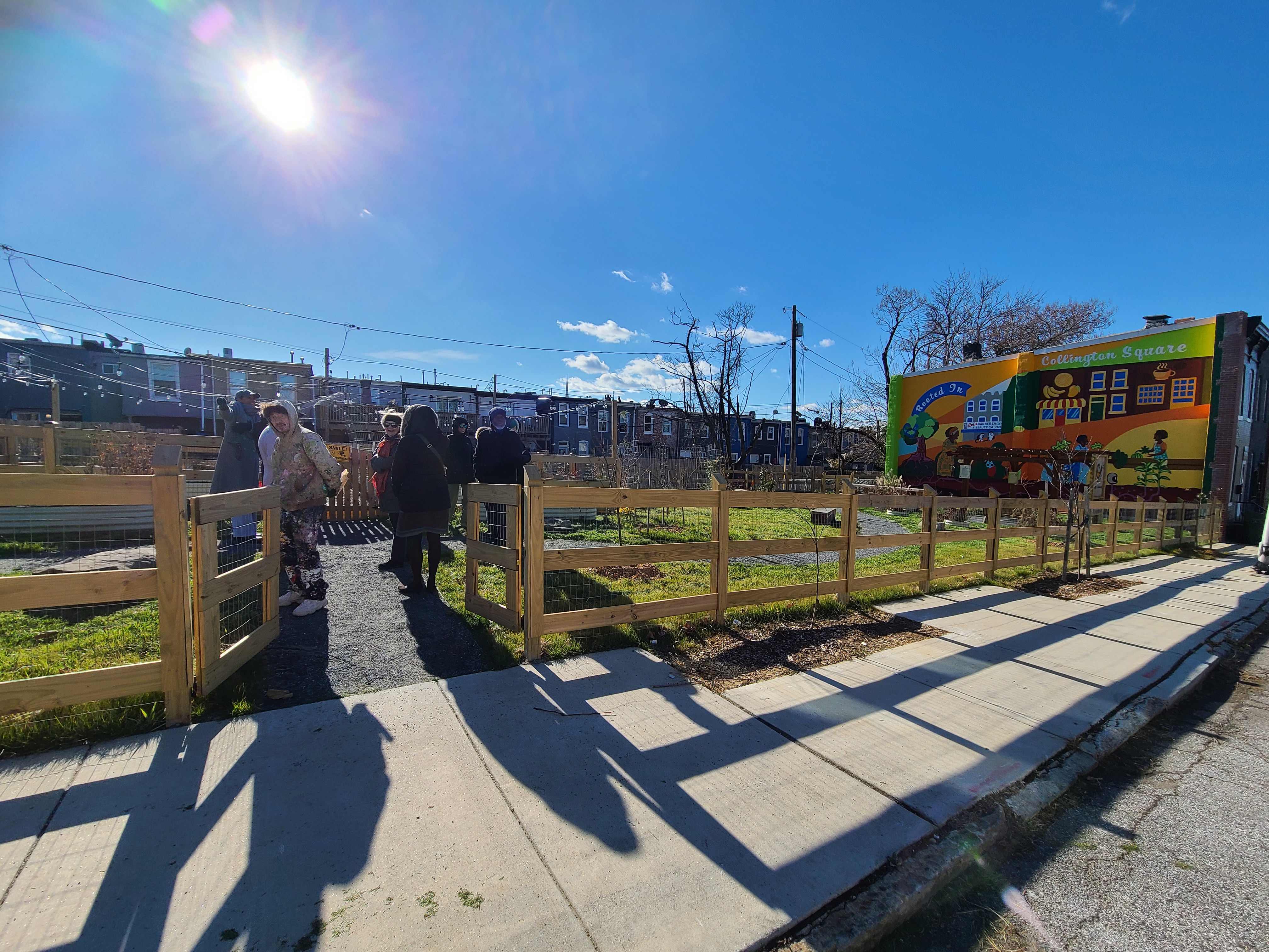 Preston 2K garden with neighbors and the Collington Square mural